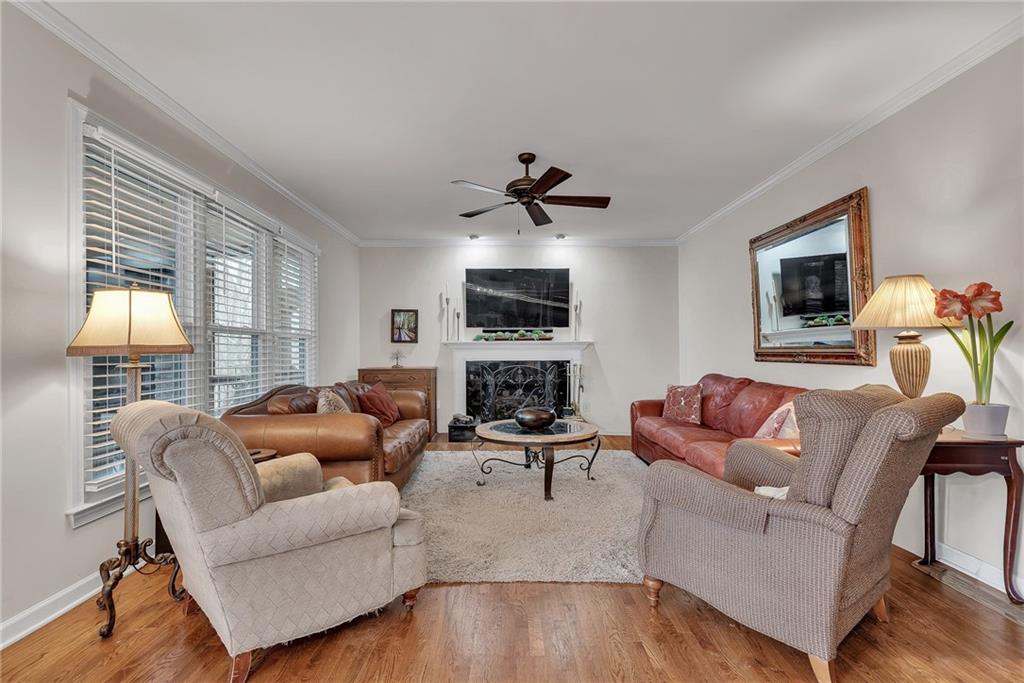 520 Fawn Run Alpharetta, GA 30005 - Photo 22 of 65 a living room with furniture a fireplace and a flat screen tv