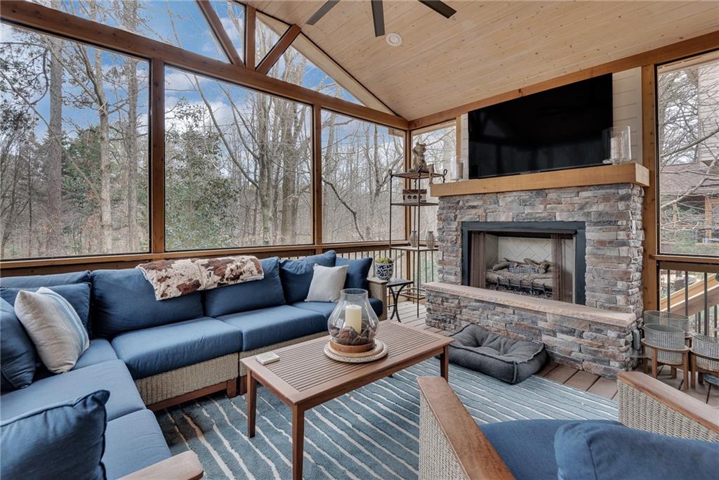 520 Fawn Run Alpharetta, GA 30005 - Photo 25 of 65 a living room with furniture a fireplace and a flat screen tv