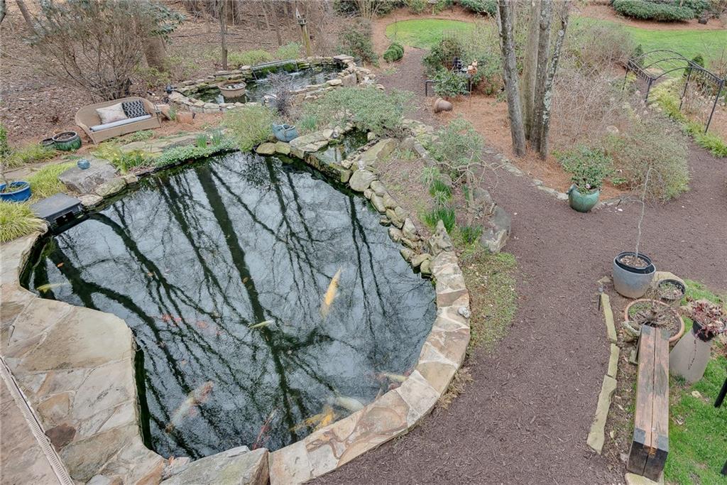 520 Fawn Run Alpharetta, GA 30005 - Photo 28 of 65 a view of a swimming pool with a yard
