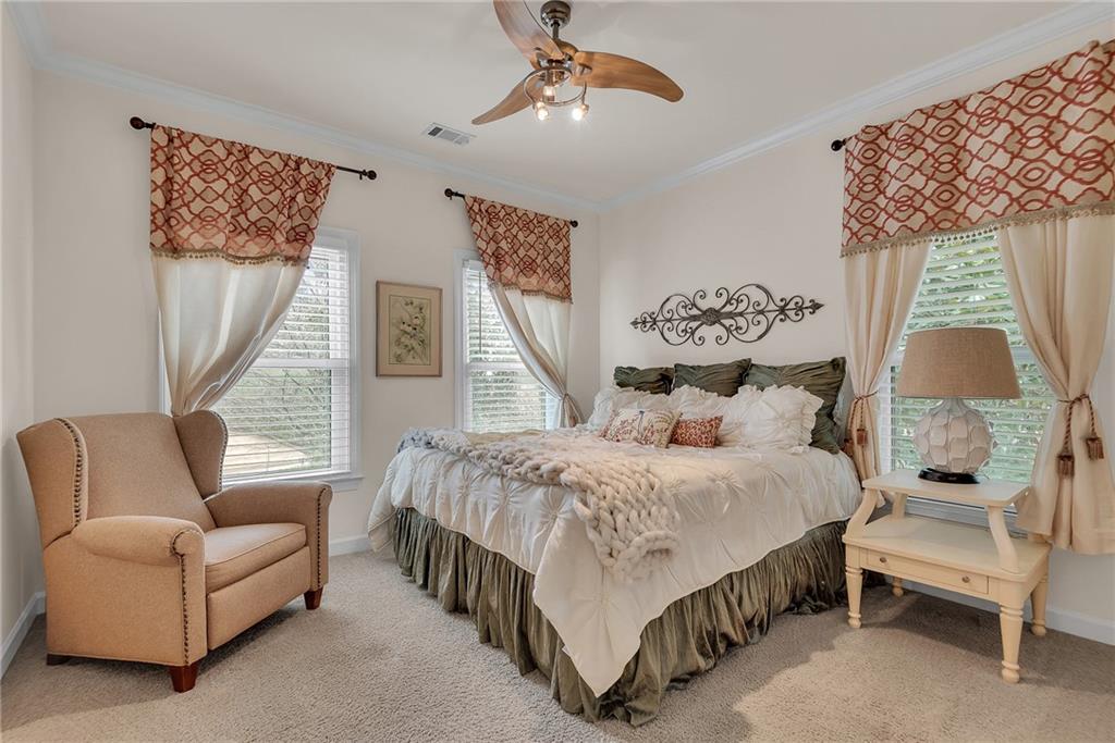 520 Fawn Run Alpharetta, GA 30005 - Photo 31 of 65 a bedroom with a bed a couch and a window