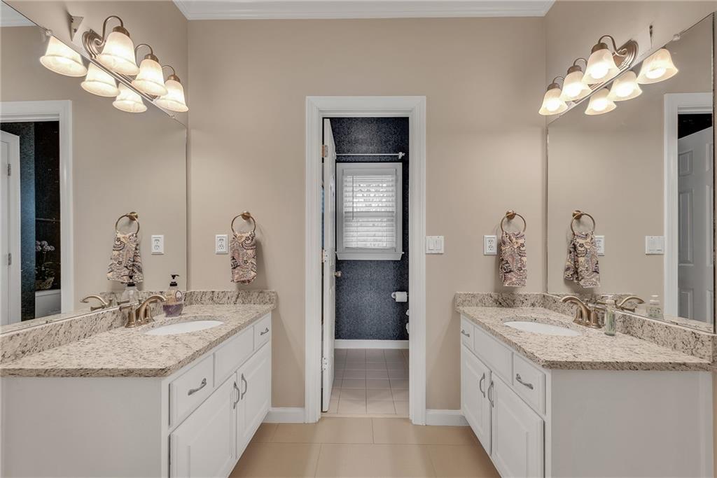 520 Fawn Run Alpharetta, GA 30005 - Photo 34 of 65 a bathroom with a sink vanity and a mirror