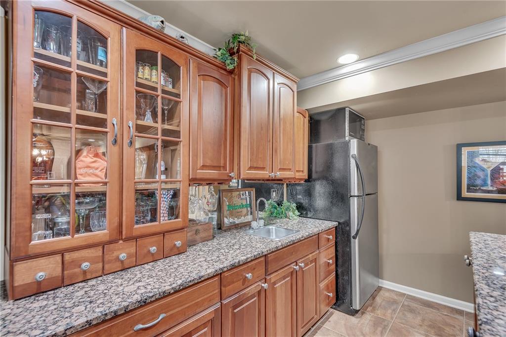 520 Fawn Run Alpharetta, GA 30005 - Photo 49 of 65 a kitchen with stainless steel appliances granite countertop a refrigerator and a sink