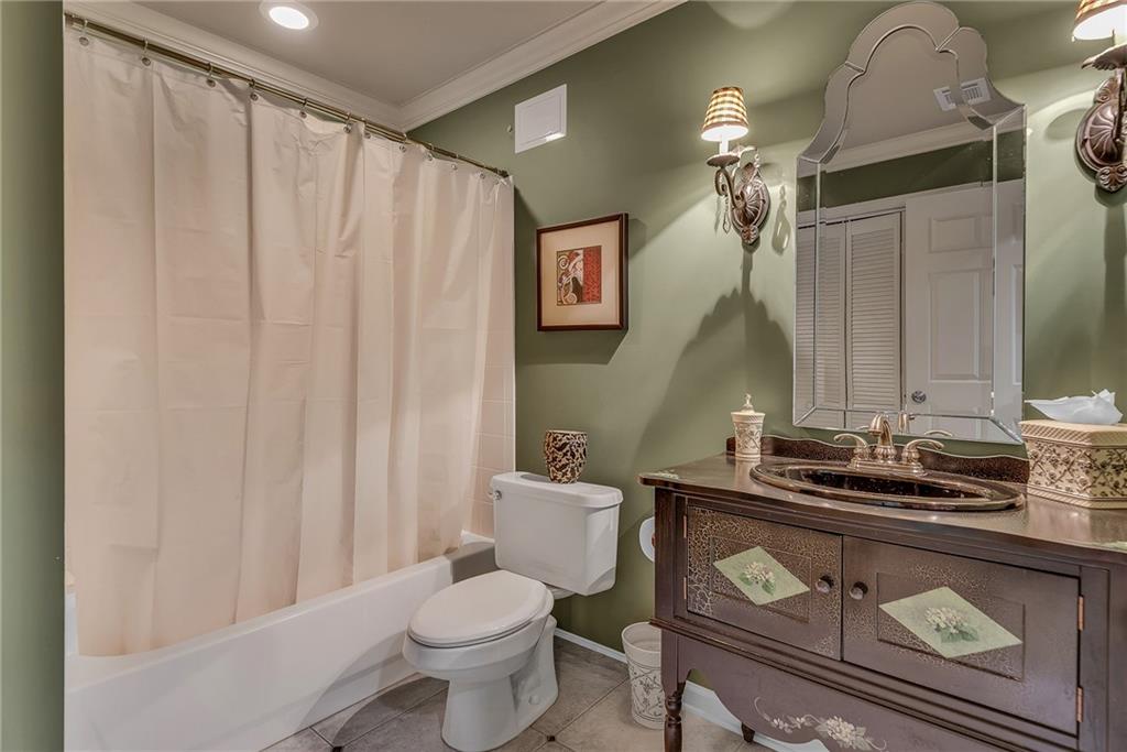 520 Fawn Run Alpharetta, GA 30005 - Photo 54 of 65 a bathroom with a toilet a sink and a mirror