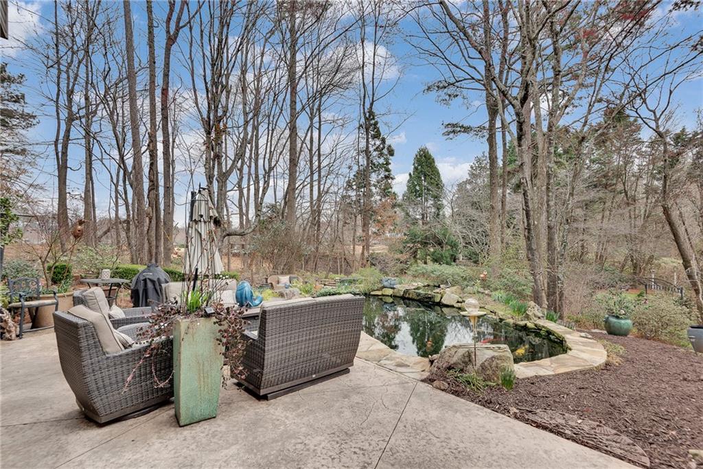 520 Fawn Run Alpharetta, GA 30005 - Photo 55 of 65 a view of patio with couches and a fire pit