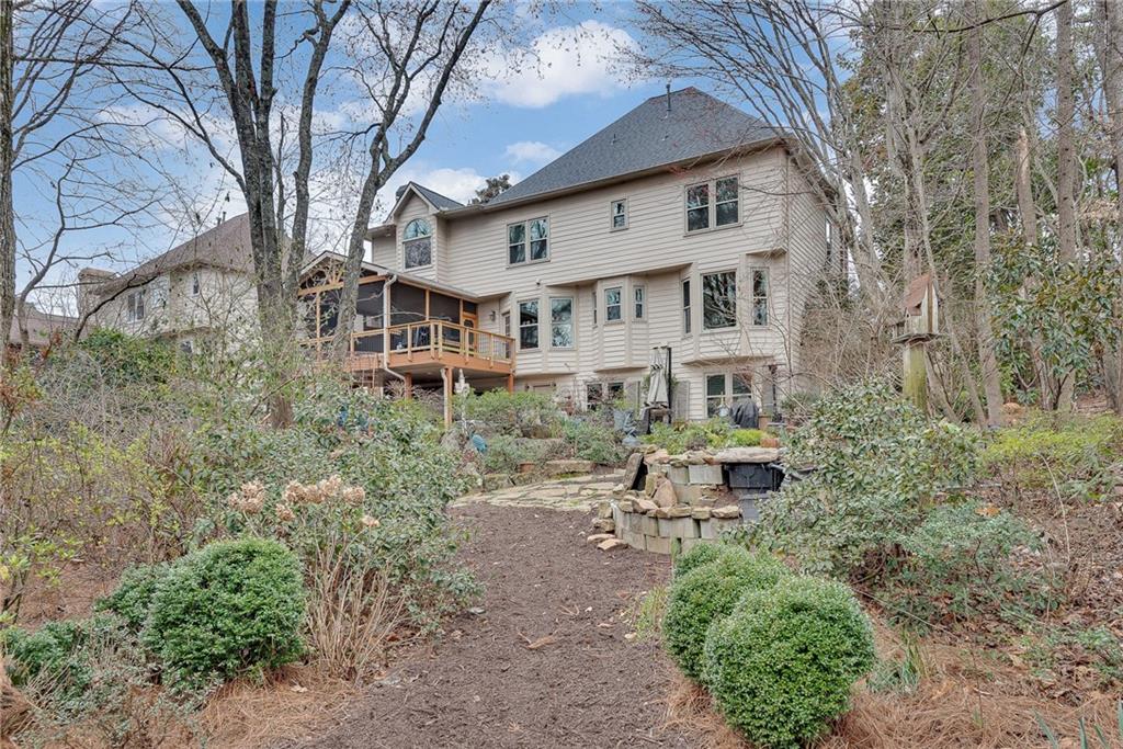 520 Fawn Run Alpharetta, GA 30005 - Photo 60 of 65 a house that has a lot of plants and trees in the background