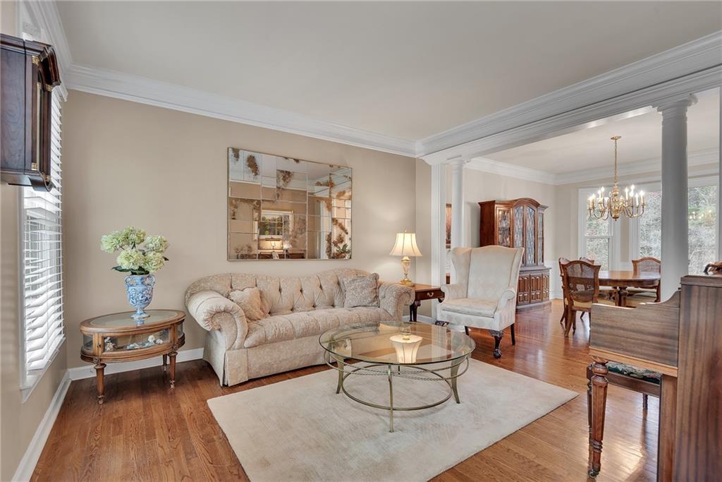 520 Fawn Run Alpharetta, GA 30005 - Photo 9 of 65 a living room with furniture dining area and a large window