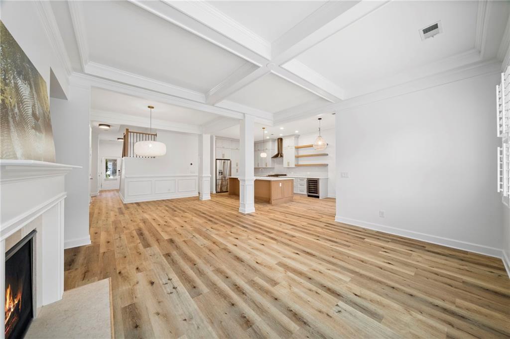3628 Ashcroft Bend Atlanta, GA 30319 - Photo 19 of 44 a view of empty room with wooden floor and fireplace