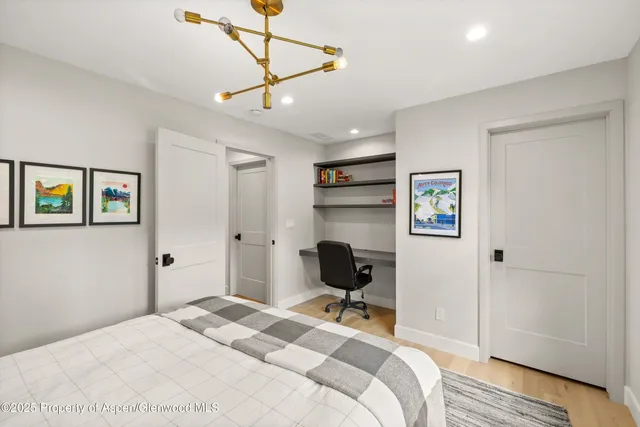 a bathroom with a double vanity sink a shower and a mirror