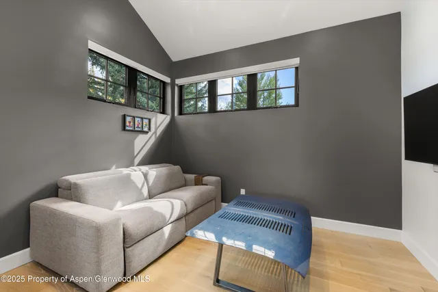 a view of an outdoor dining space with a table and chairs