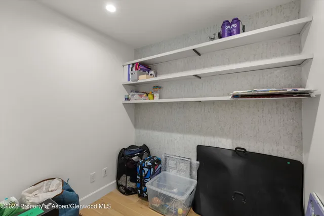 a bathroom with a sink a toilet and a shower