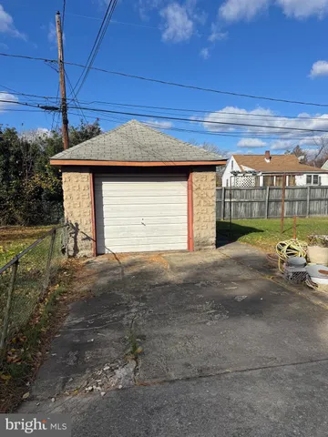 a front view of a building with a yard