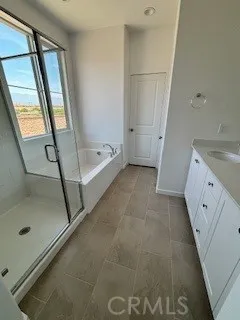 a bathroom with a granite countertop sink a mirror and a shower