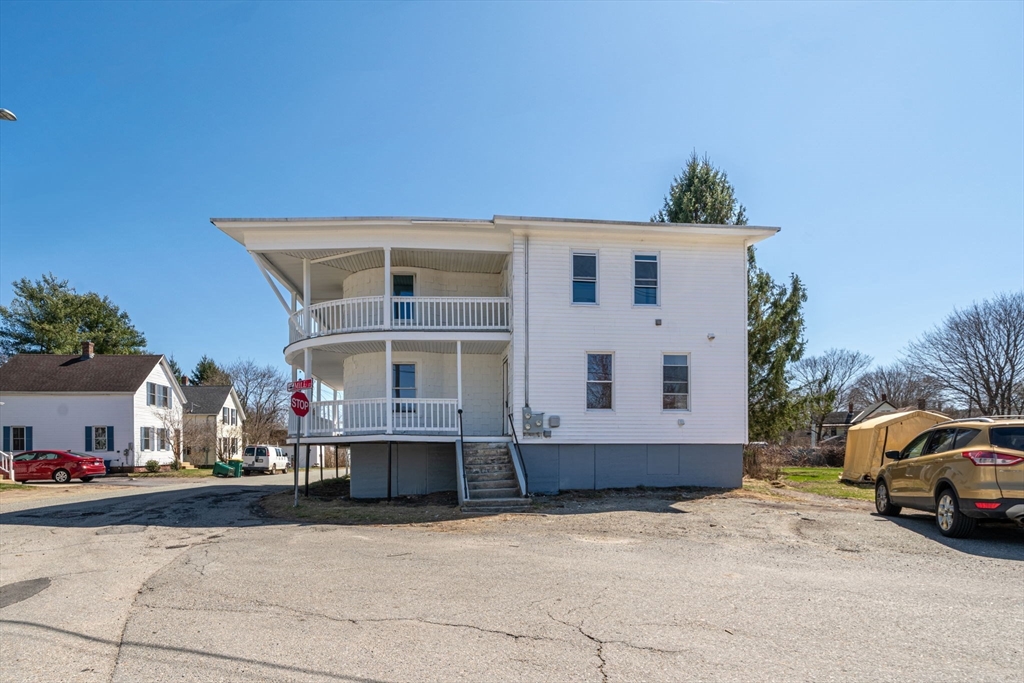 142 Spruce Street Winchendon, MA 01475 - Photo 1 of 34 a front view of a house with cars parked