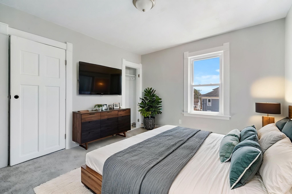 142 Spruce Street Winchendon, MA 01475 - Photo 12 of 34 a bedroom with a bed a television and a window