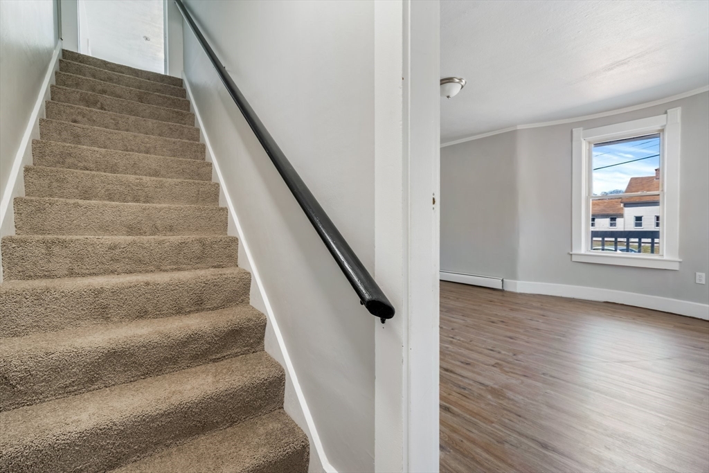 142 Spruce Street Winchendon, MA 01475 - Photo 16 of 34 a view of staircase with wooden floor and white walls