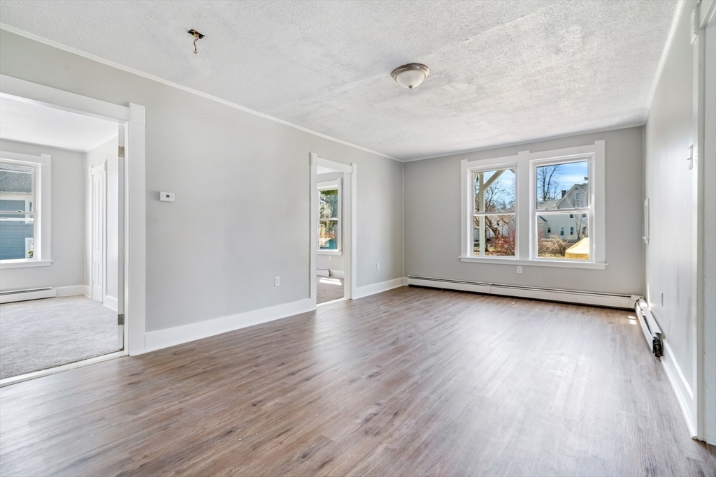 142 Spruce Street Winchendon, MA 01475 - Photo 18 of 34 an empty room with wooden floor and windows