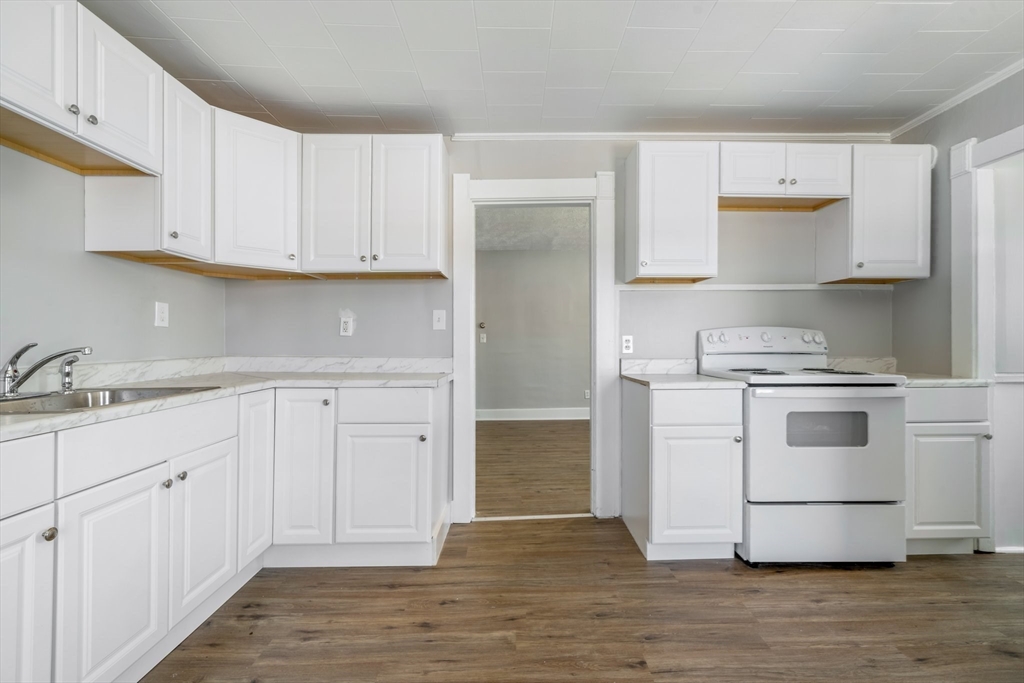 142 Spruce Street Winchendon, MA 01475 - Photo 22 of 34 a kitchen with white cabinets and white appliances