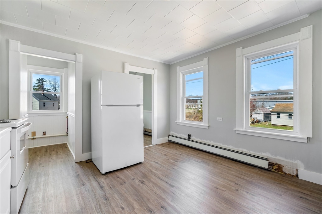 142 Spruce Street Winchendon, MA 01475 - Photo 23 of 34 a view of an empty room with a window and wooden floor