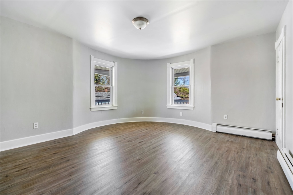 142 Spruce Street Winchendon, MA 01475 - Photo 25 of 34 an empty room with wooden floor and windows