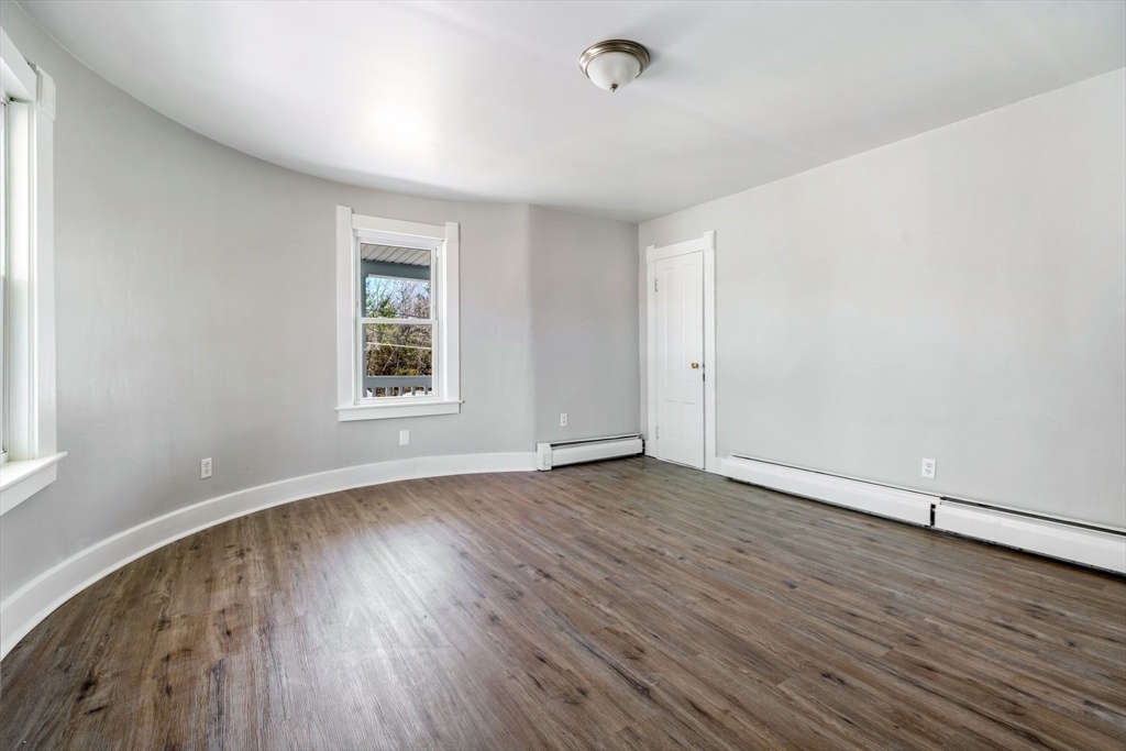 142 Spruce Street Winchendon, MA 01475 - Photo 26 of 34 an empty room with wooden floor and windows
