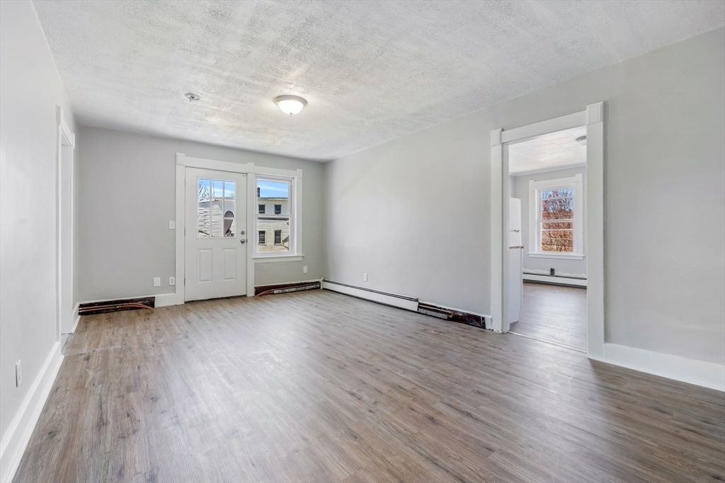 142 Spruce Street Winchendon, MA 01475 - Photo 30 of 34 an empty room with wooden floor and windows