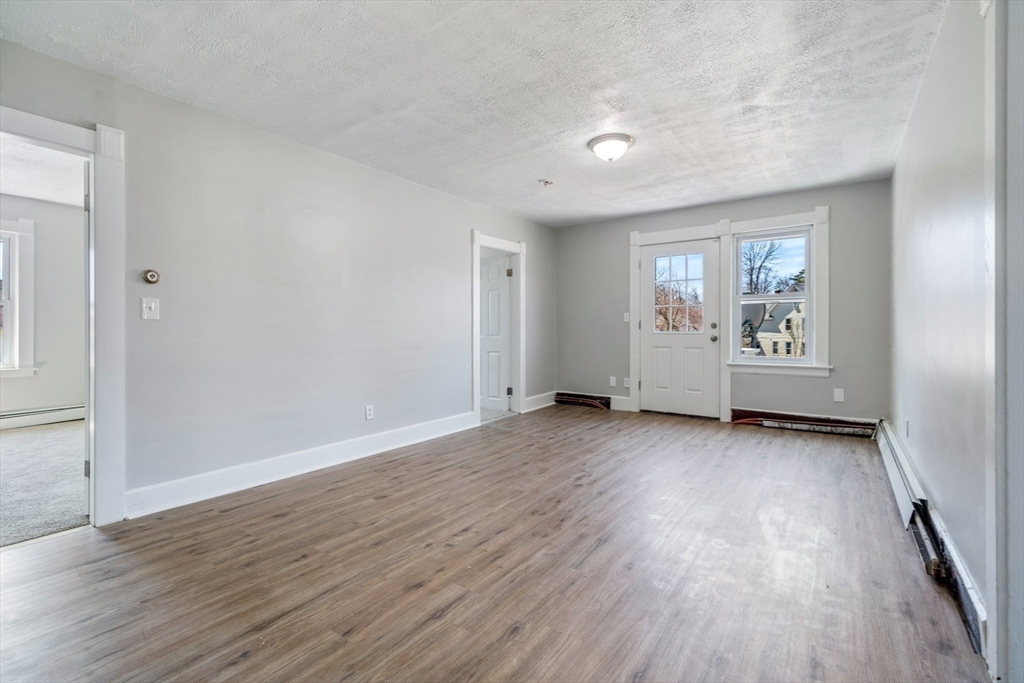 142 Spruce Street Winchendon, MA 01475 - Photo 31 of 34 an empty room with wooden floor and windows