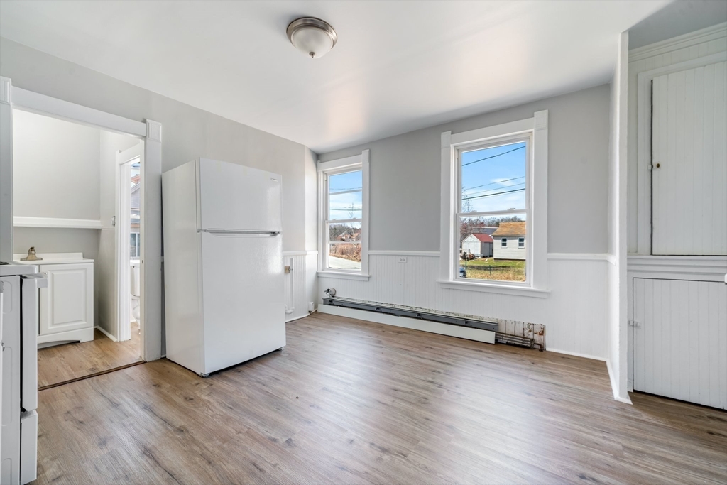 142 Spruce Street Winchendon, MA 01475 - Photo 8 of 34 an empty room with wooden floor and windows