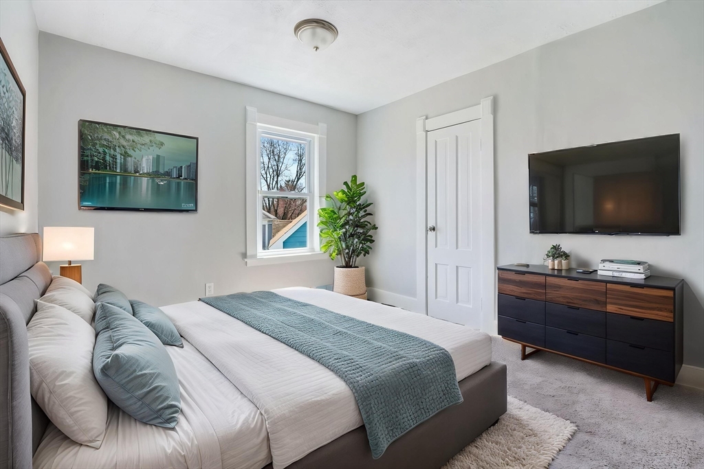 142 Spruce Street Winchendon, MA 01475 - Photo 9 of 34 a bedroom with a bed and a flat screen tv
