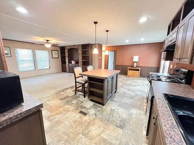 a view of a porch with wooden floor and stairs