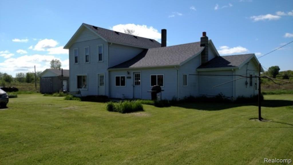 9183 Metcalf Road Avoca, MI 48006 - Photo 17 of 18 This is a side front view of the home.