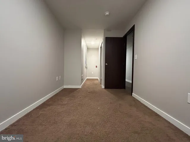 an empty room with closet area