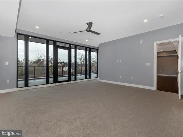 a bathroom with a shower sink and mirror