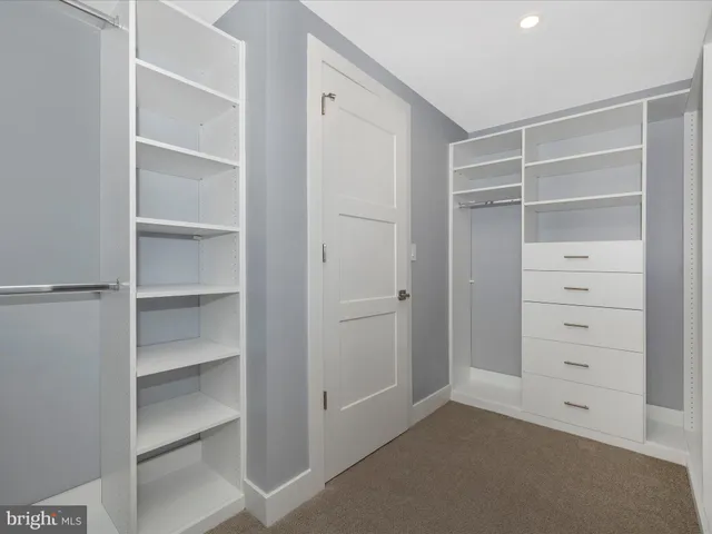 a view of an empty room with a balcony