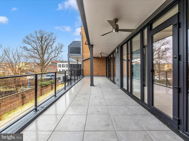 an aerial view of residential houses with city view