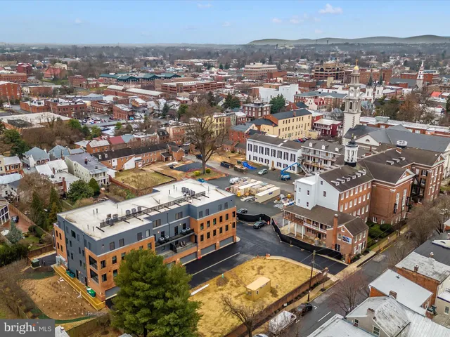 a front view of a building with glass windows