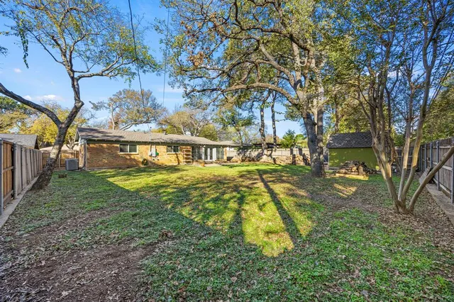 a view of swimming pool with a yard