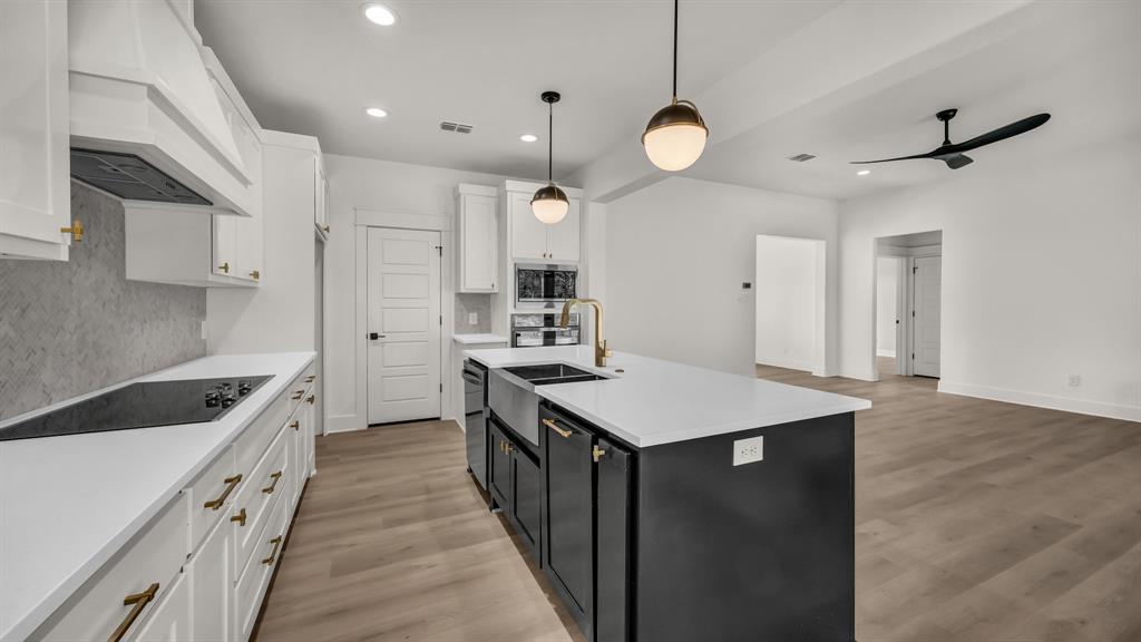 225 Jefferson Way Weatherford, TX 76088 - Photo 14 of 35 a kitchen with cabinets appliances and a counter top