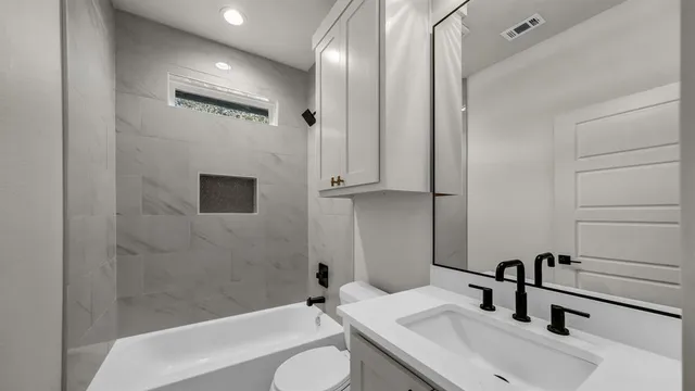 a view of an empty room with window and chandelier fan