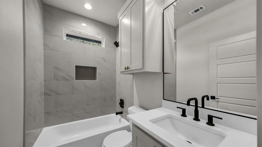 225 Jefferson Way Weatherford, TX 76088 - Photo 26 of 35 a bathroom with a sink and a mirror