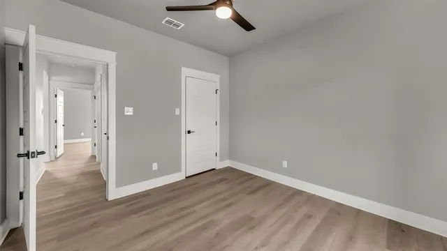 a front view of a house with a yard and outdoor seating