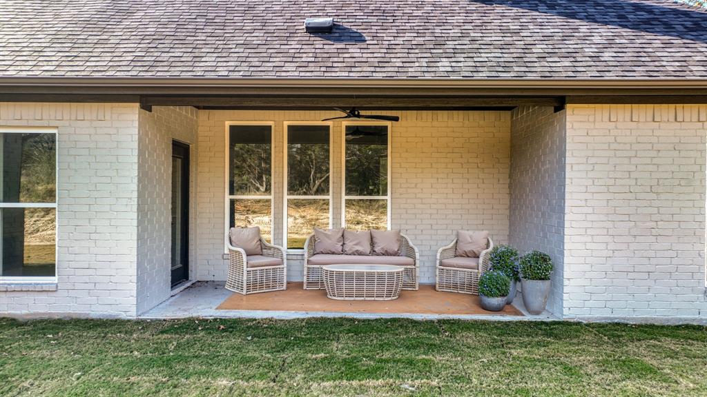 225 Jefferson Way Weatherford, TX 76088 - Photo 29 of 35 a front view of a house with a yard and outdoor seating