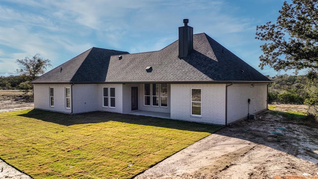 225 Jefferson Way Weatherford, TX 76088 - Photo 32 of 35 a front view of a house with a yard