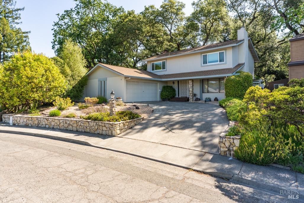 436 Candlelight Drive Santa Rosa, CA 95403 - Photo 1 of 1 a front view of a house with a yard and garage