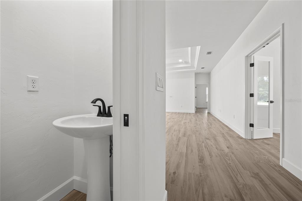 1050 Southwest 67th Drive Gainesville, FL 32607 - Photo 19 of 28 a bathroom with a sink and mirror