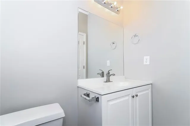 a bathroom with a sink and mirror