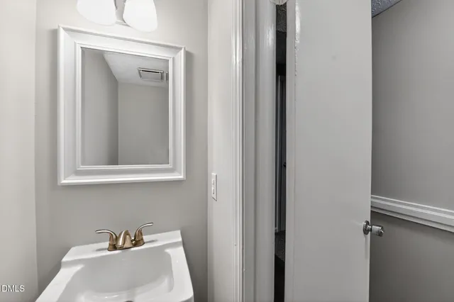 a bathroom with a sink and a vanity