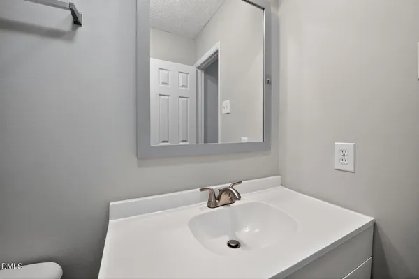 a bathroom with a sink and a toilet