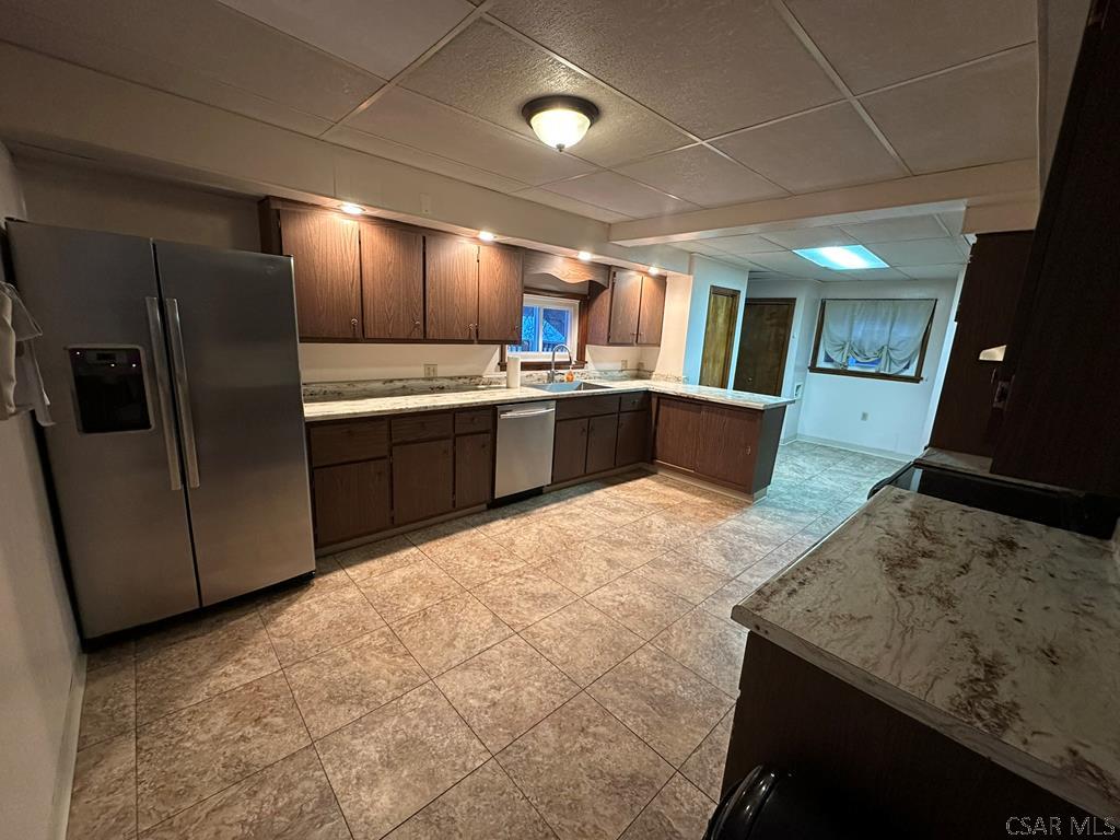 312 12th Street Windber, PA 15963 - Photo 3 of 24 a large kitchen with a stove a sink a microwave and refrigerator
