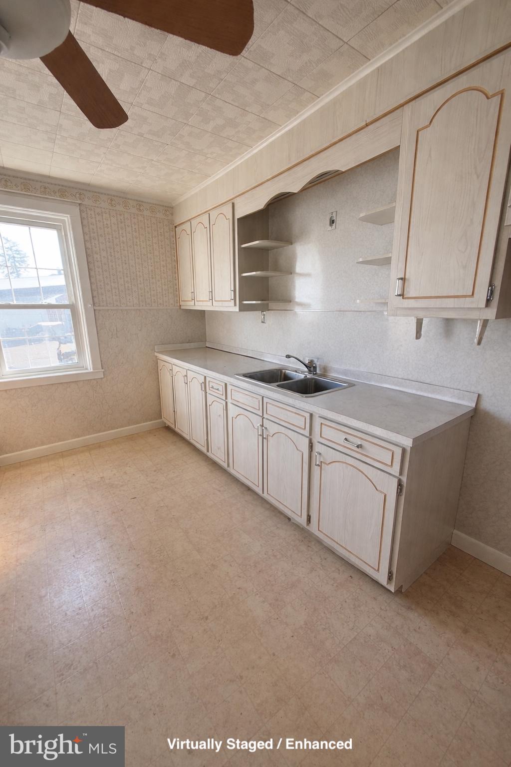 935 Easton Road Hellertown, PA 18055 - Photo 15 of 29 a kitchen with sink cabinets and window