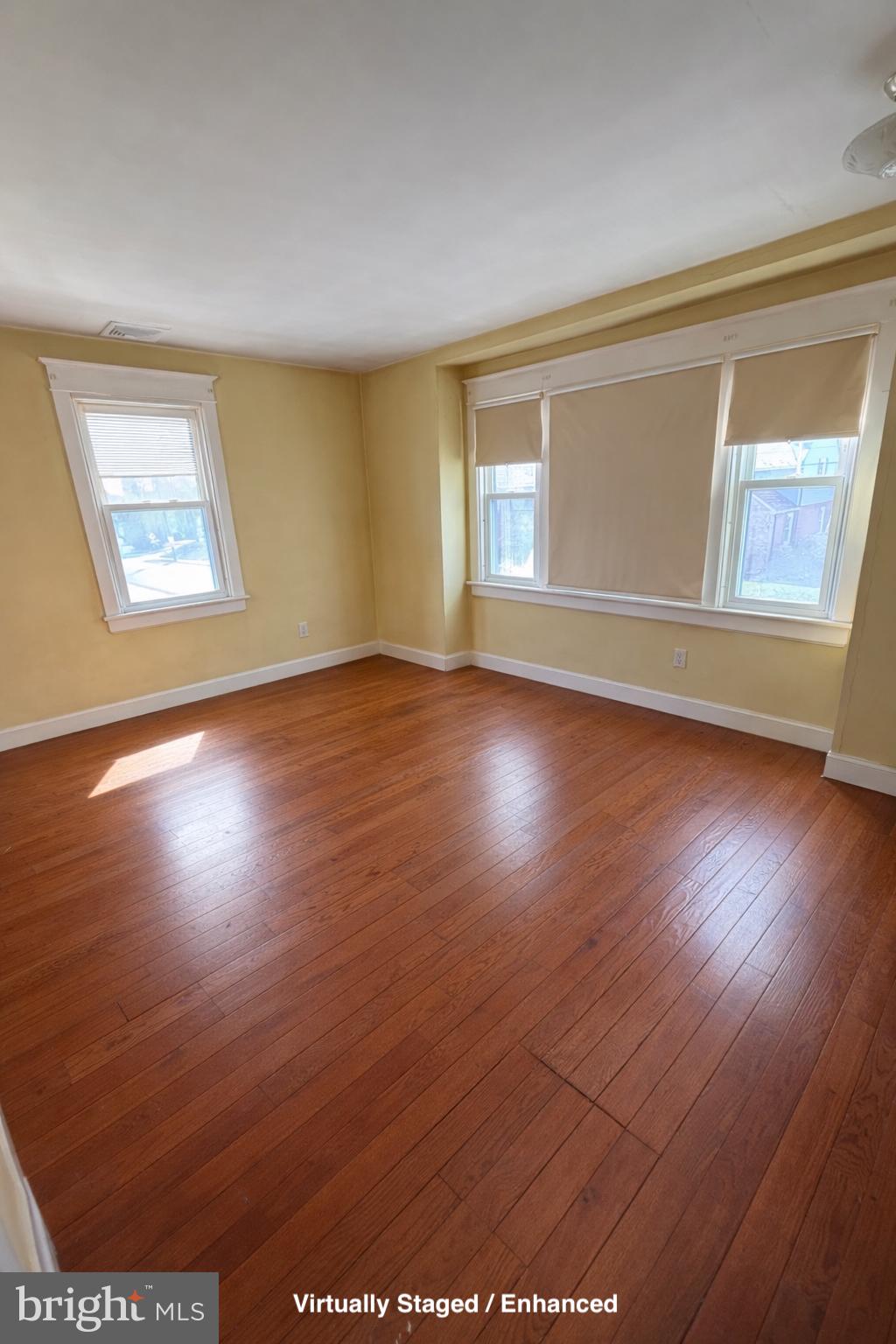 935 Easton Road Hellertown, PA 18055 - Photo 26 of 29 a view of an empty room with wooden floor and a window